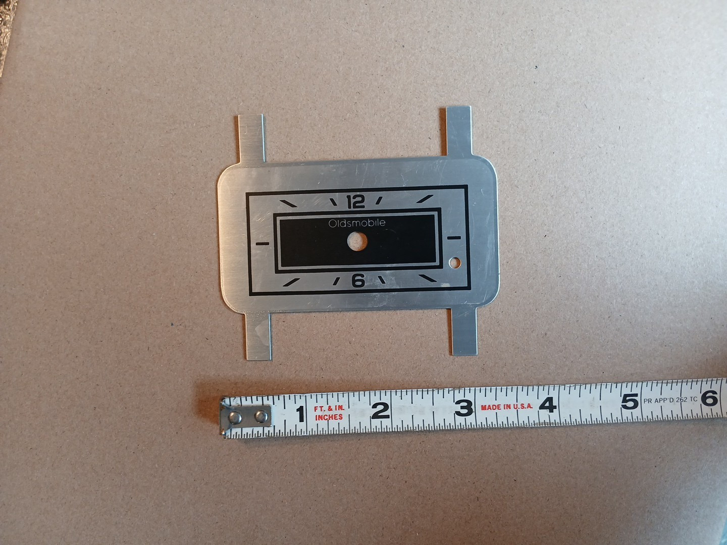 Vintage NOS GM Oldsmobile Gauge Metal Clock Plate Face Part – 1977 Cutlass