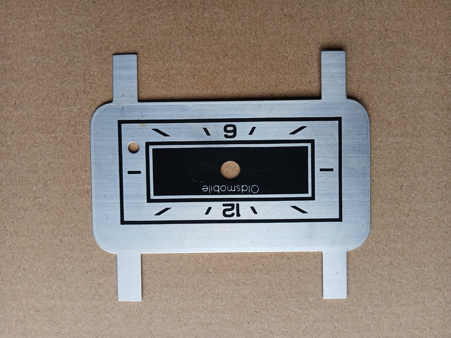 Vintage NOS GM Oldsmobile Gauge Metal Clock Plate Face Part – 1977 Cutlass